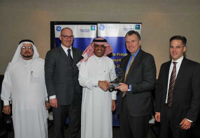 A file photo of a contract signing ceremony between GE and Saudi Aramco. A file photo of a contract signing ceremony between GE and Saudi Aramco.