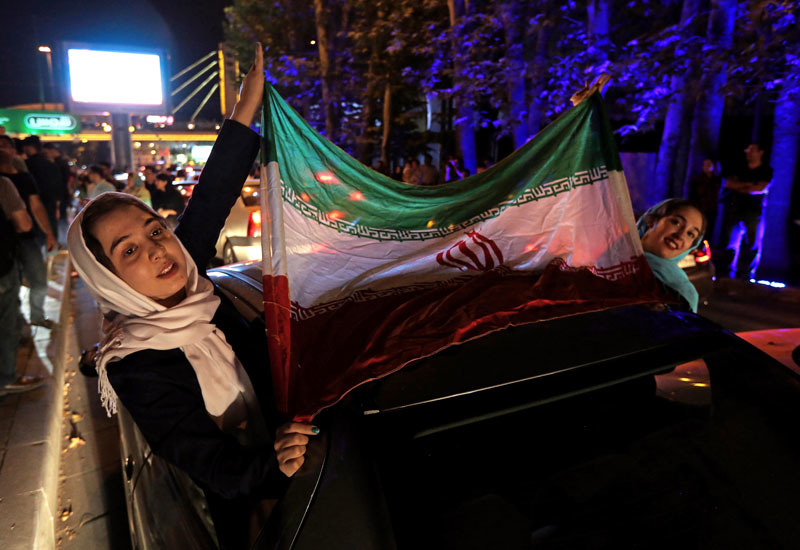 Iranians celebrate the removal of sanctions on the Islamic Republic, in Tehran in January. Iranians celebrate the removal of sanctions on the Islamic Republic, in Tehran in January.