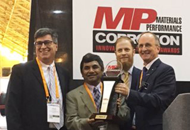 The three-member development team for Amercoat One coating – from left, Jim McCarthy, Kam Sheth and David Curran – accepted the Corrosion Innovation of the Year Award from NACE International President Sandy Williamson (far right) on March 27. The three-member development team for Amercoat One coating – from left, Jim McCarthy, Kam Sheth and David Curran – accepted the Corrosion Innovation of the Year Award from NACE International President Sandy Williamson (far right) on March 27.