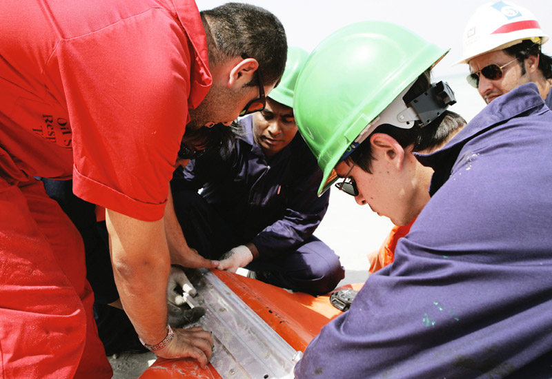 Engineers listen as they are talked through their training programme. Engineers listen as they are talked through their training programme.