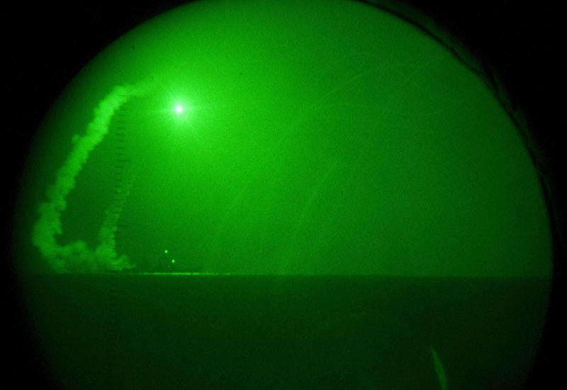 Seen through night-vision lenses, a guided missile destroyer fires a Tomahawk cruise missile in support of Operation Odyssey Dawn off the Libyan coast Seen through night-vision lenses, a guided missile destroyer fires a Tomahawk cruise missile in support of Operation Odyssey Dawn off the Libyan coast