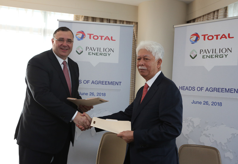 Patrick Pouyanne, chairman and CEO of Total (left) and Tan Sri Mohd Hassan Marican, chairman of Pavilion Energy sign the HoA. Patrick Pouyanne, chairman and CEO of Total (left) and Tan Sri Mohd Hassan Marican, chairman of Pavilion Energy sign the HoA.