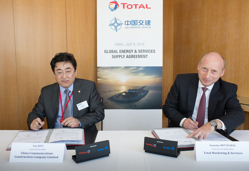 Total and CCCC sign the contract securing their tie-up. Total and CCCC sign the contract securing their tie-up.