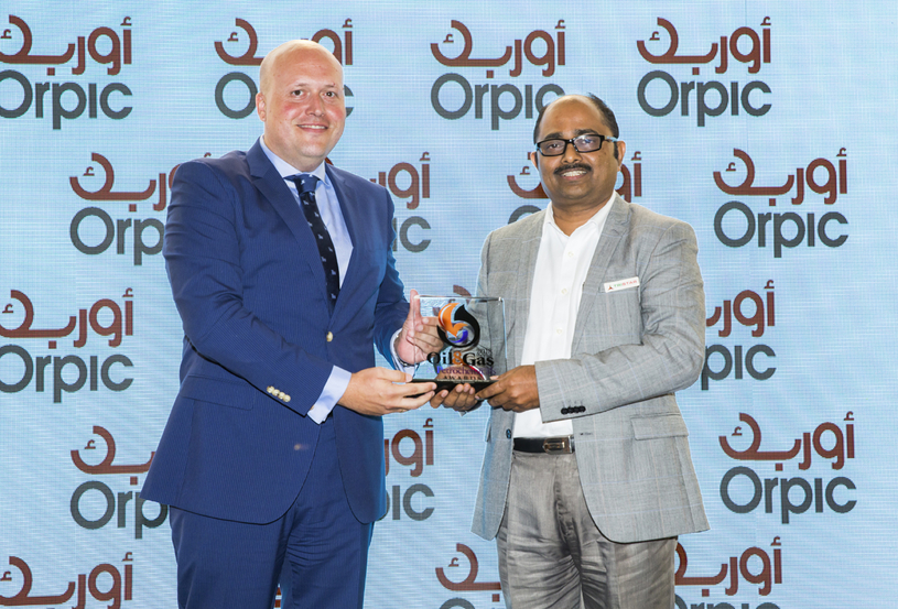 Shivananda Baikady (right), general manager for road transport and warehousing, Tristar Group, receives the 2018 ‘Logistics Provider of the Year’ Award, won by Tristar Transport, from Andres Suarez, general manager, logistics, at Orpic. Shivananda Baikady (right), general manager for road transport and warehousing, Tristar Group, receives the 2018 ‘Logistics Provider of the Year’ Award, won by Tristar Transport, from Andres Suarez, general manager, logistics, at Orpic.